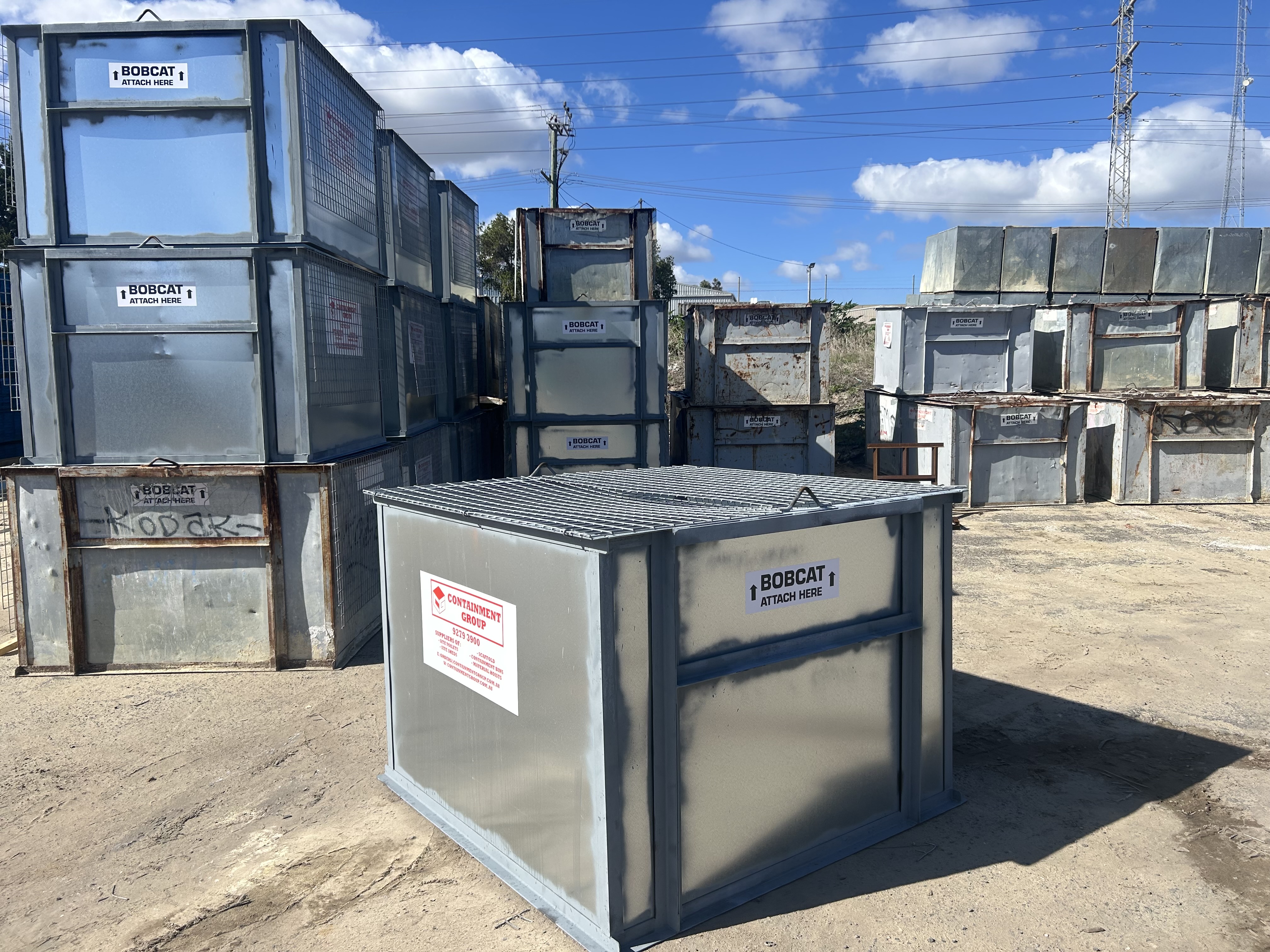 Containment Group bobcat-attach bins stacked at the Bibra Lake yard